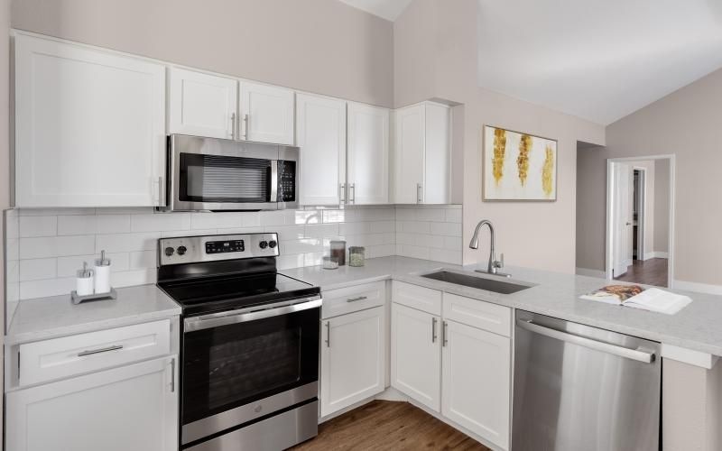 Spacious kitchens with thoughtful details a kitchen with white cabinets