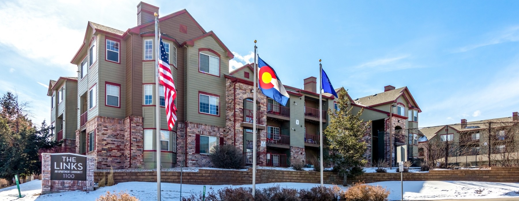a building with flags in front of it