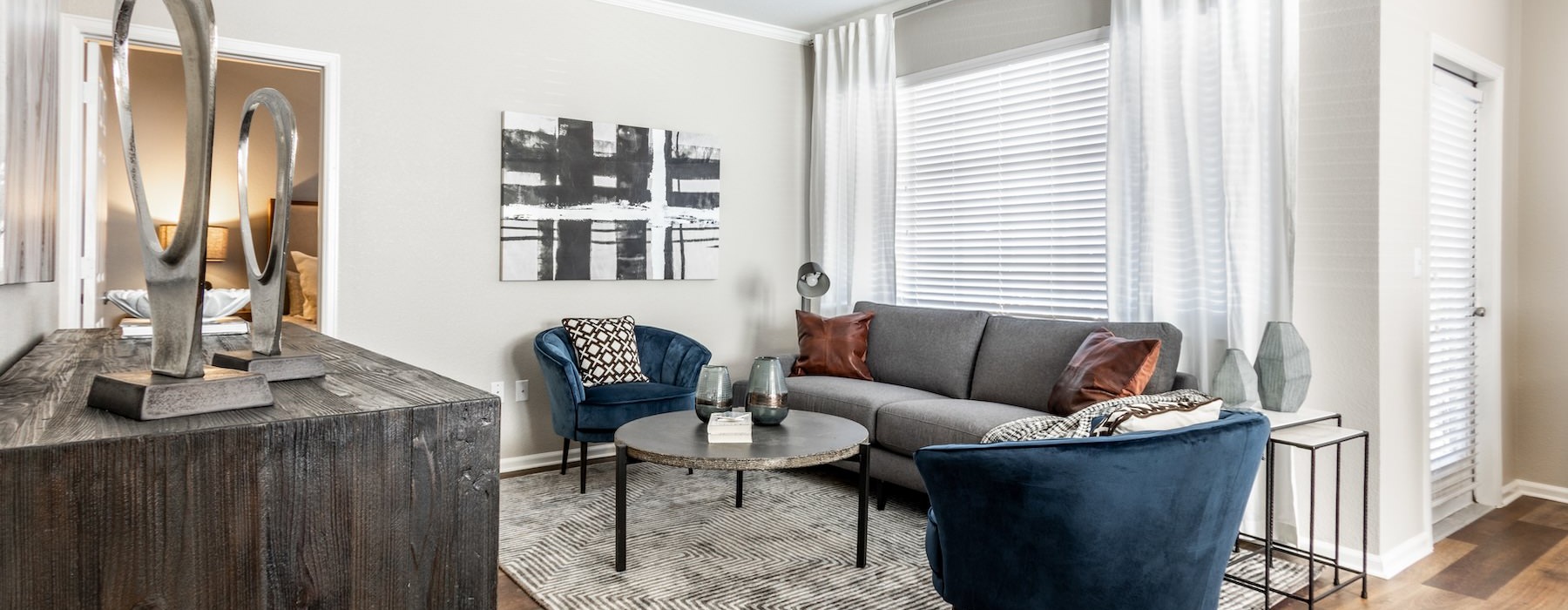 a living room with a couch and chairs