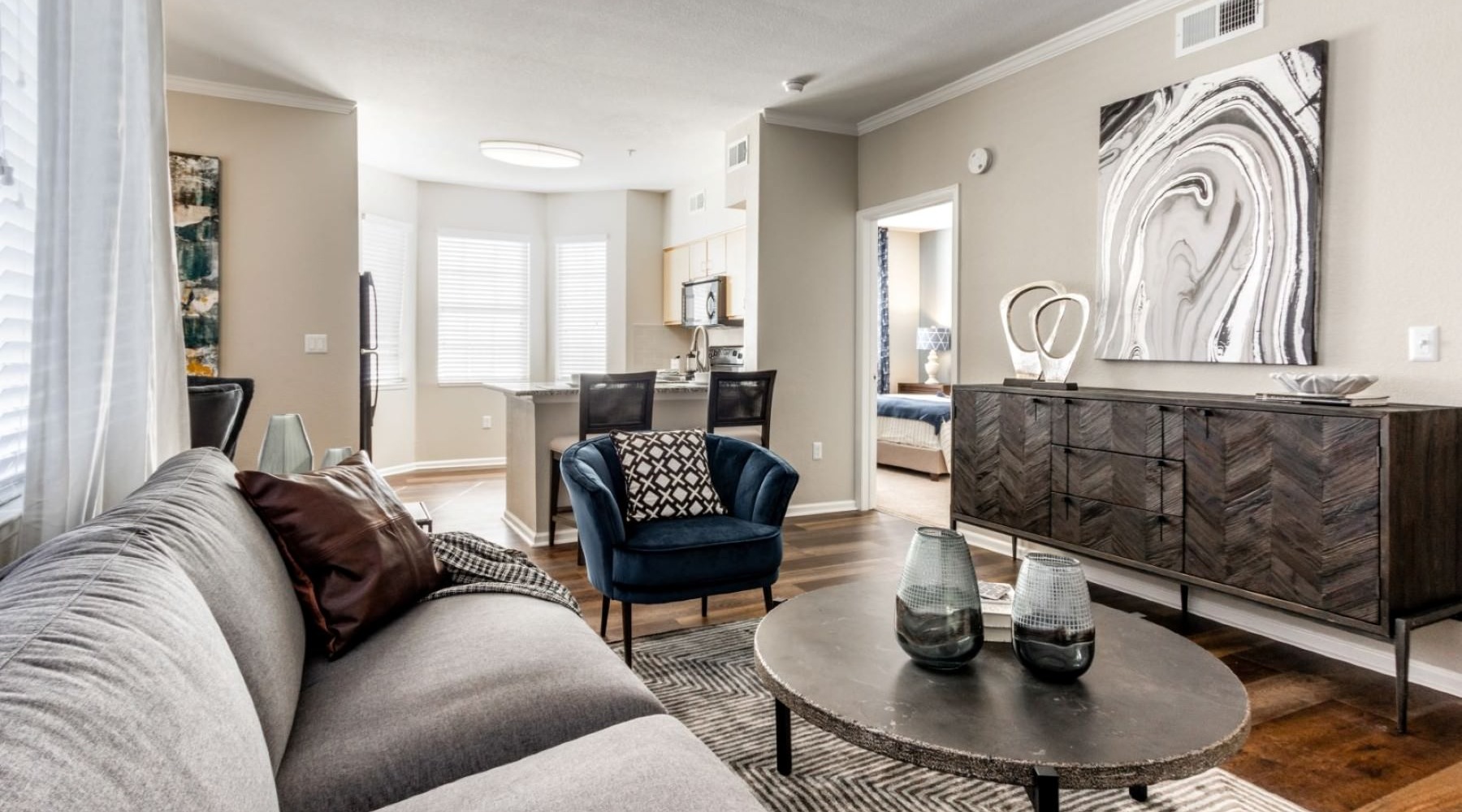 Refined spaces to match your style a living room with a couch and a coffee table