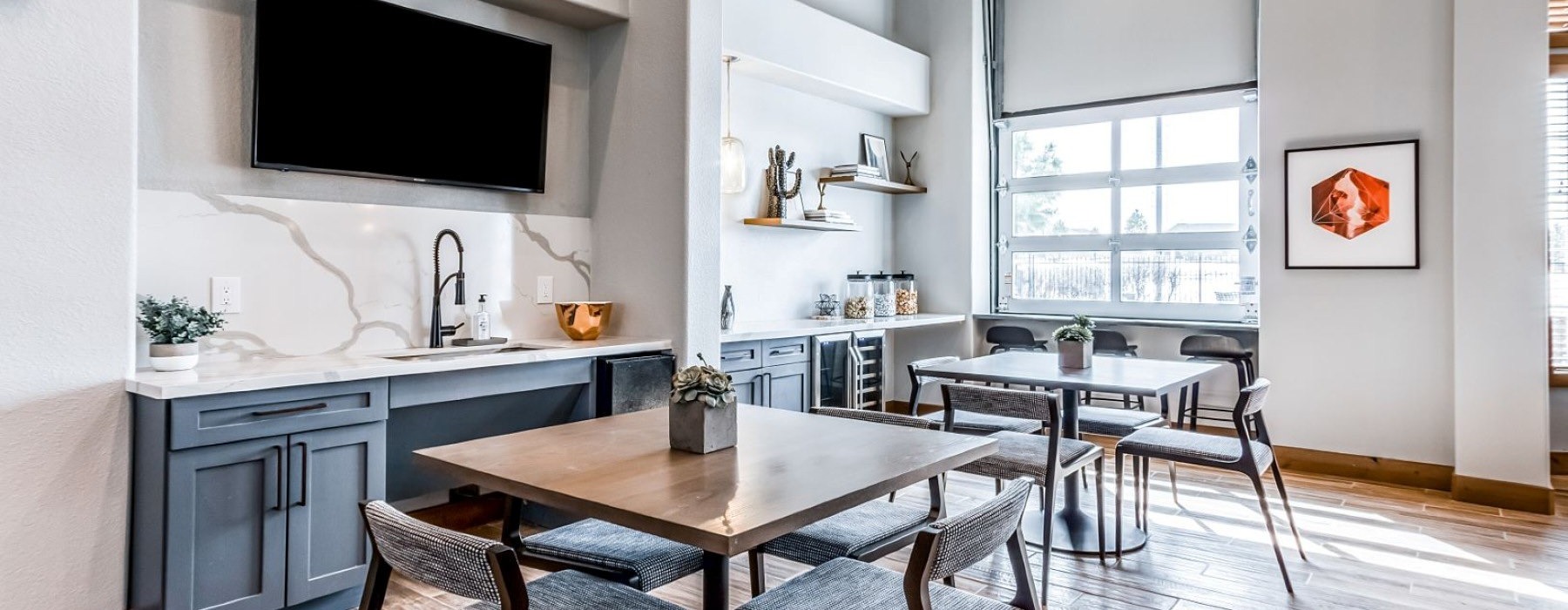 a community kitchen with a table and chairs