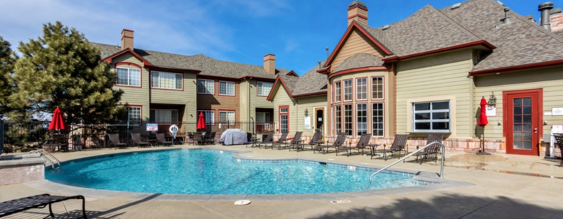a swimming pool in front of a building