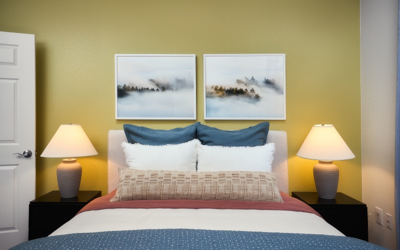 bedroom with paintings