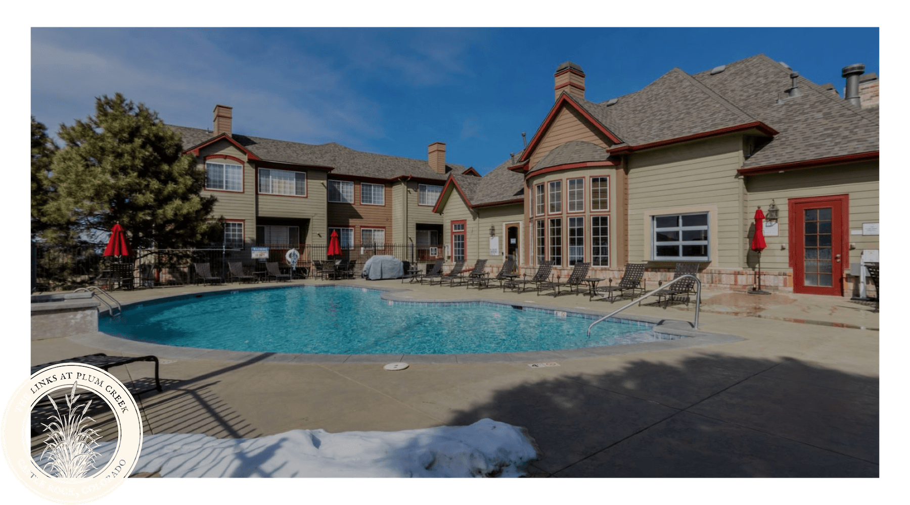 a swimming pool in front of a building
