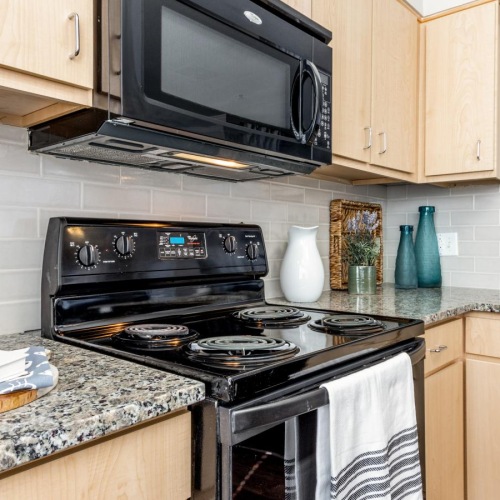 Spacious kitchens with thoughtful details a kitchen with a stove and oven